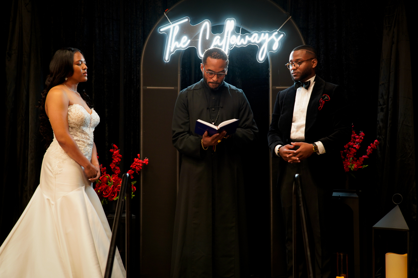 Wedding ceremony — groom in black velvet tuxedo