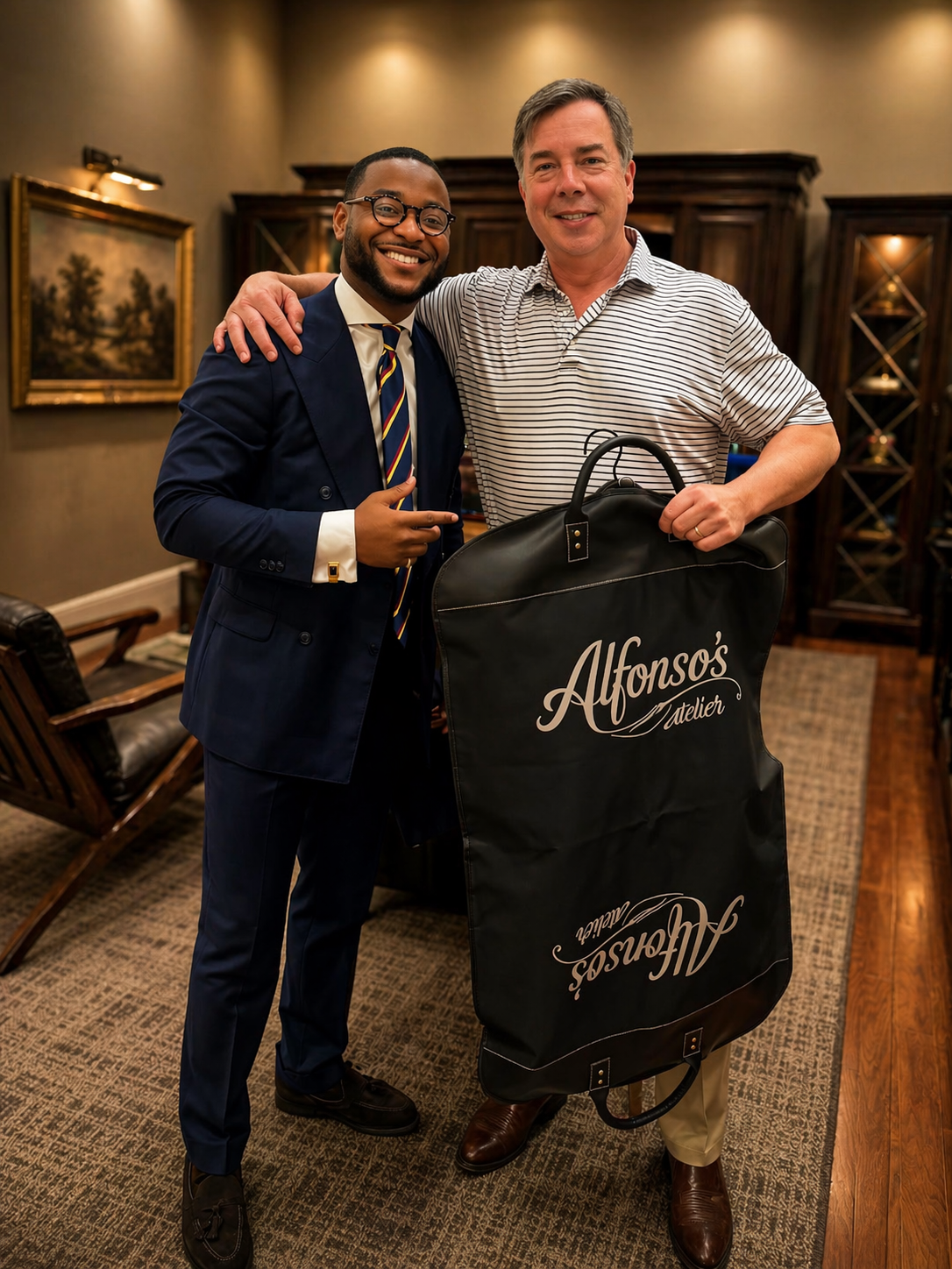 Client receiving his finished suit at the atelier