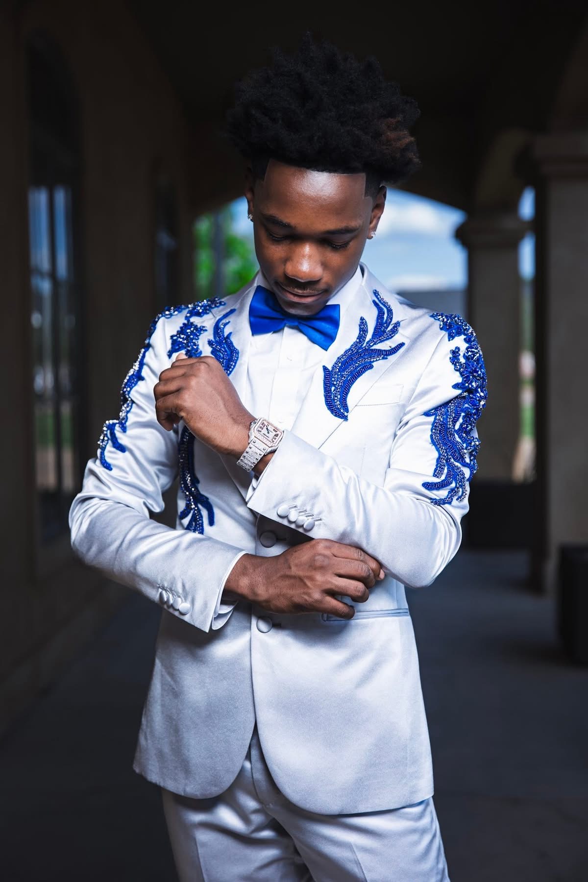 Close-up of silver tuxedo with cobalt blue beaded shoulder embellishment