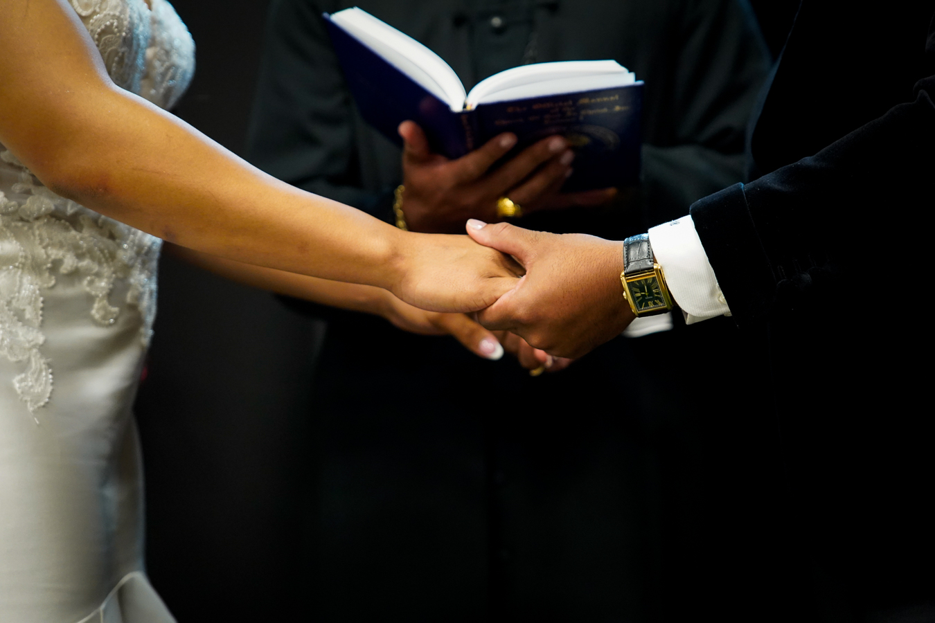 Hands and cuffs detail during ceremony