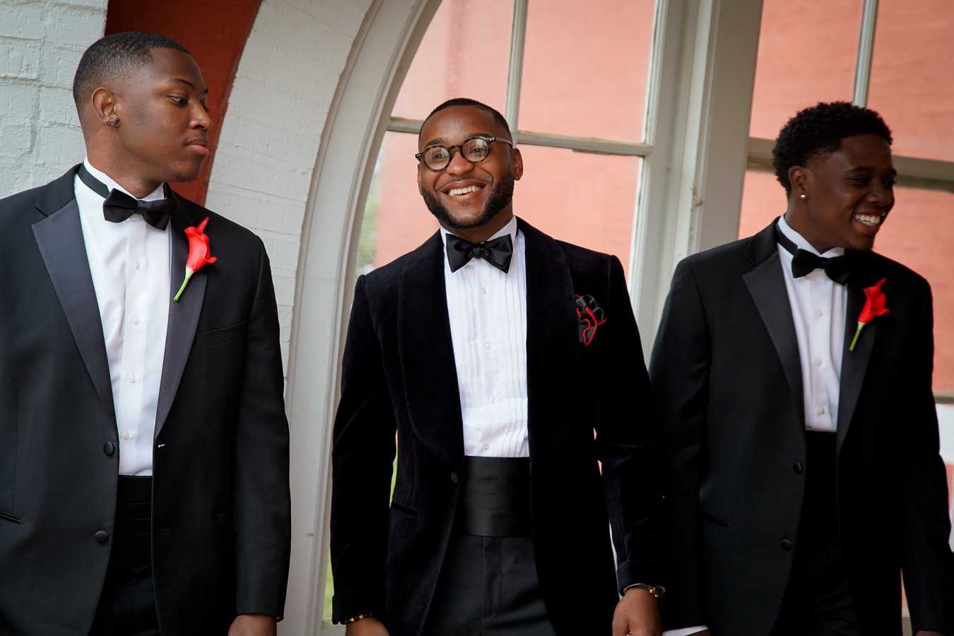 Three men in black velvet tuxedos